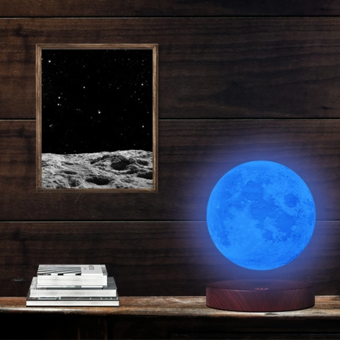 blue Levitating Moon next to frame